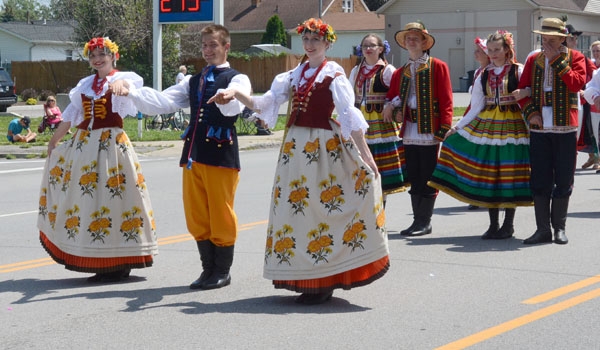 Polish traditional dress and dancing entertain those watching the Pulaski Day Parade